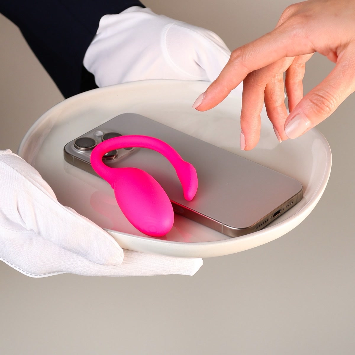The Flamingo served on a tray beside a phone, white-glove style
